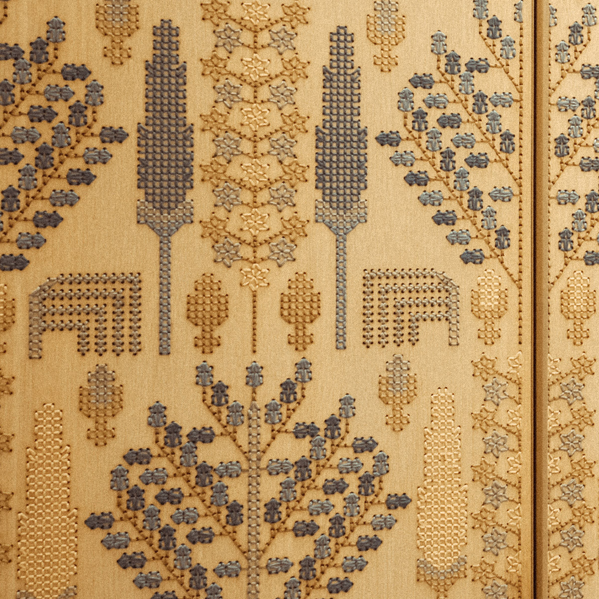 Close-up of White Oak veneer embroidered with cotton thread in blue, beige and ochre, featuring carpet-inspired geometric and botanical motifs with subtle gold sequins.