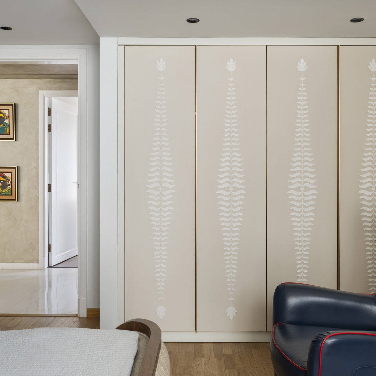 Custom embroidered wallpaper with vertical fern motif installed on wardrobe shutters, scaled from prototype study, New Delhi residence.