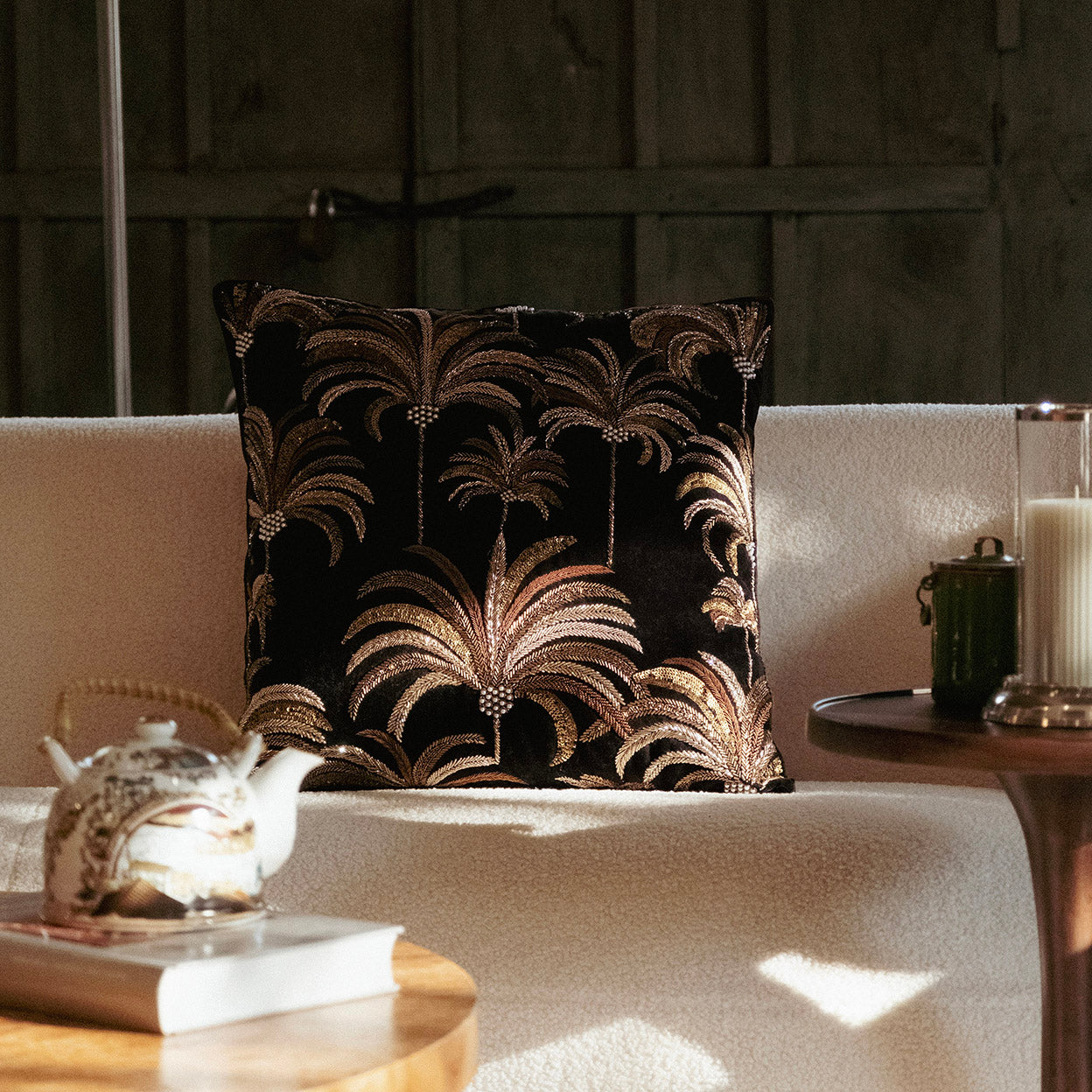 Embroidered textile surface study featuring metallic zari articulation and palm motif