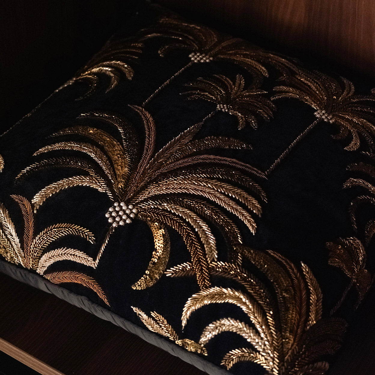 Close-up of layered embroidery density and metallic thread construction